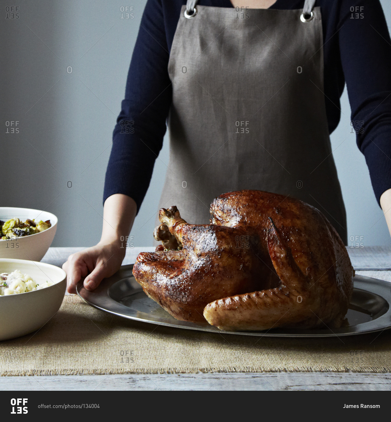 Close up of woman serving a Thanksgiving turkey