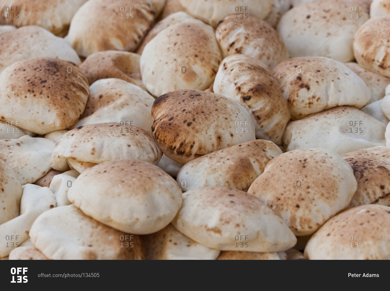 Heap of traditionally baked Pita breads in a market in Cairo, Egypt