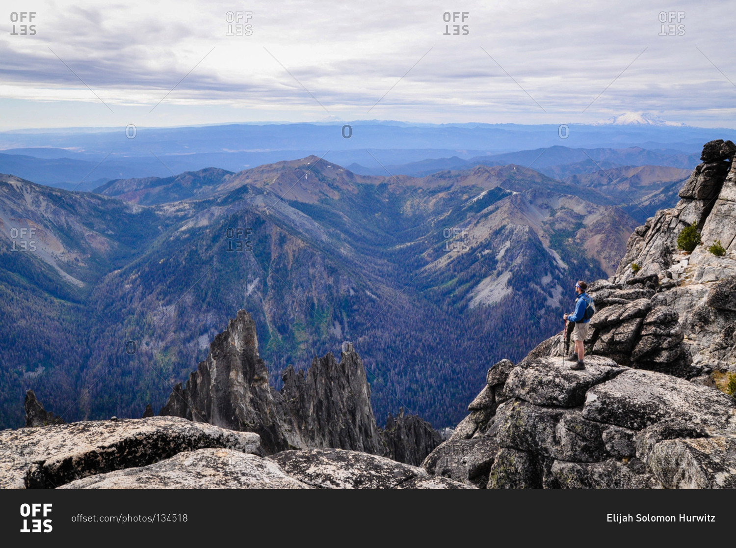 Hiker taking in the view of a mountain range