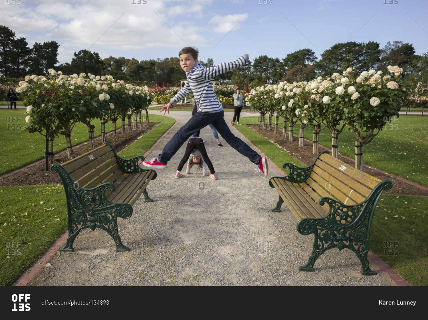 Young children playing in a rose garden, Werribee, Victoria