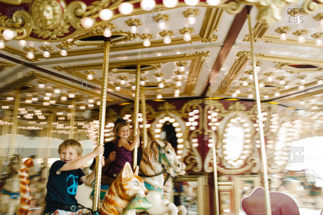 Children riding carousel