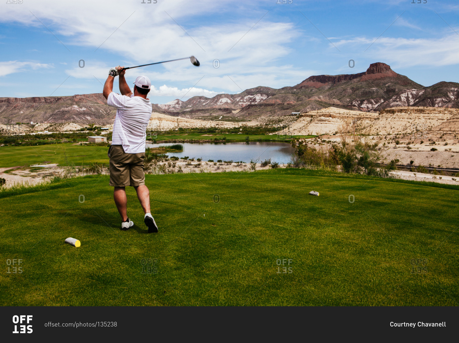 A golfer tees off at a golf resort, Lajitas, Texas