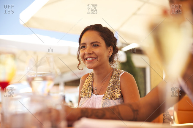 Portrait of woman sitting in an outdoor restaurant