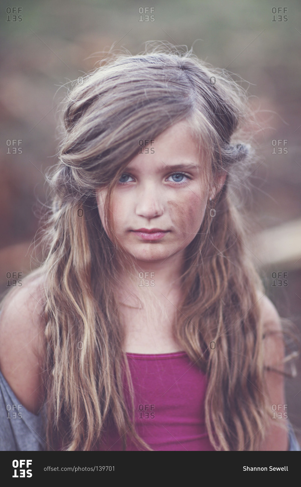 Portrait of a pretty girl with dirt on her face stock photo OFFSET