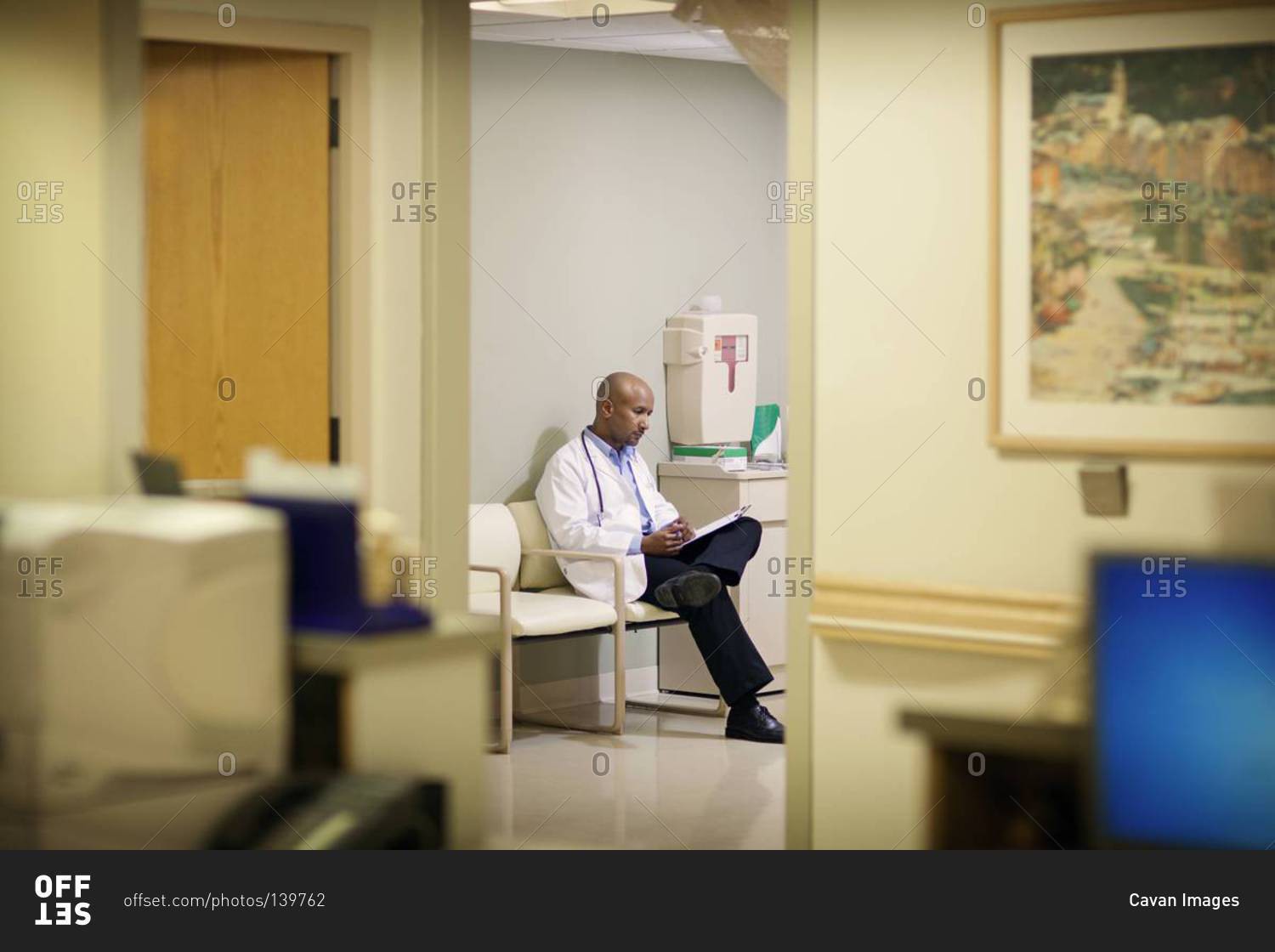 Doctor sitting in a waiting room in a hospital