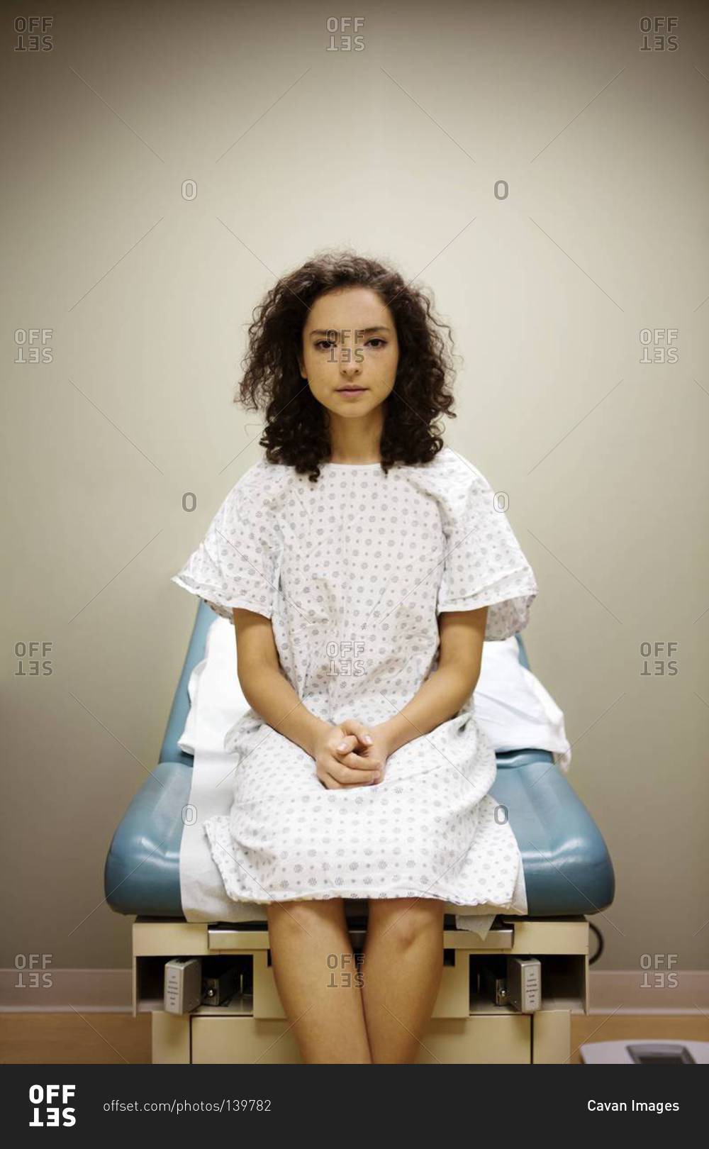 Woman Waiting In Examination Room Stock Photo Offset