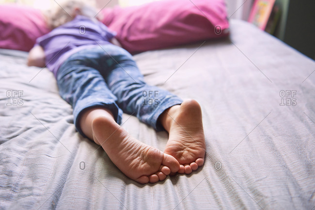Feet Of A Sleeping Baby. On The Crib Stock Photo - Image 
