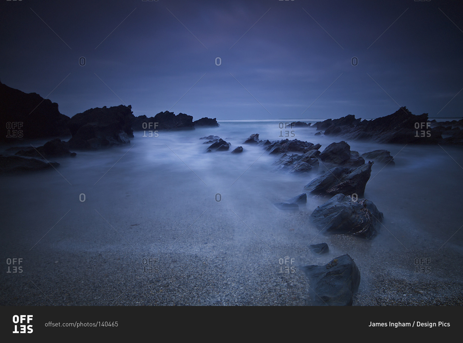 Long exposure of rocks on the beach at night