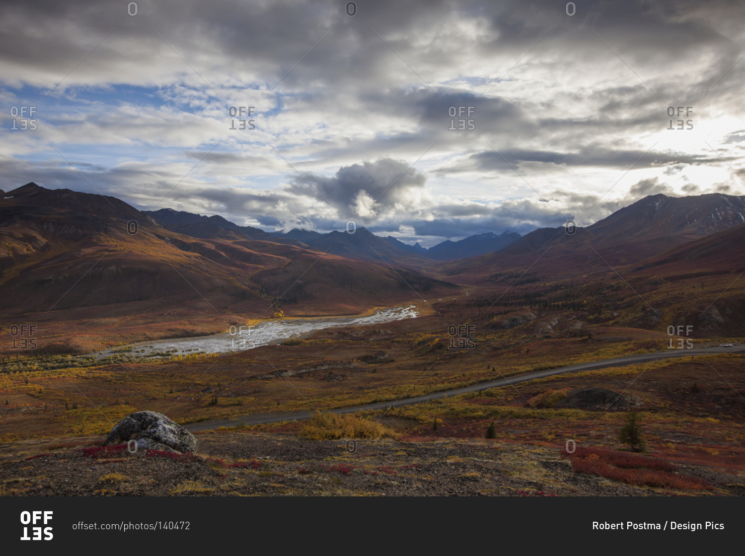 The Dempster highway and klondike valley with the tundra covered in autumn colors