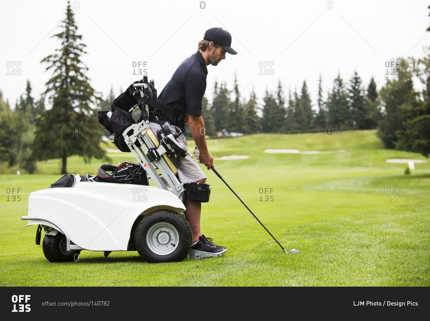Disabled golfer in a tournament using high tech mobility aid, Edmonton