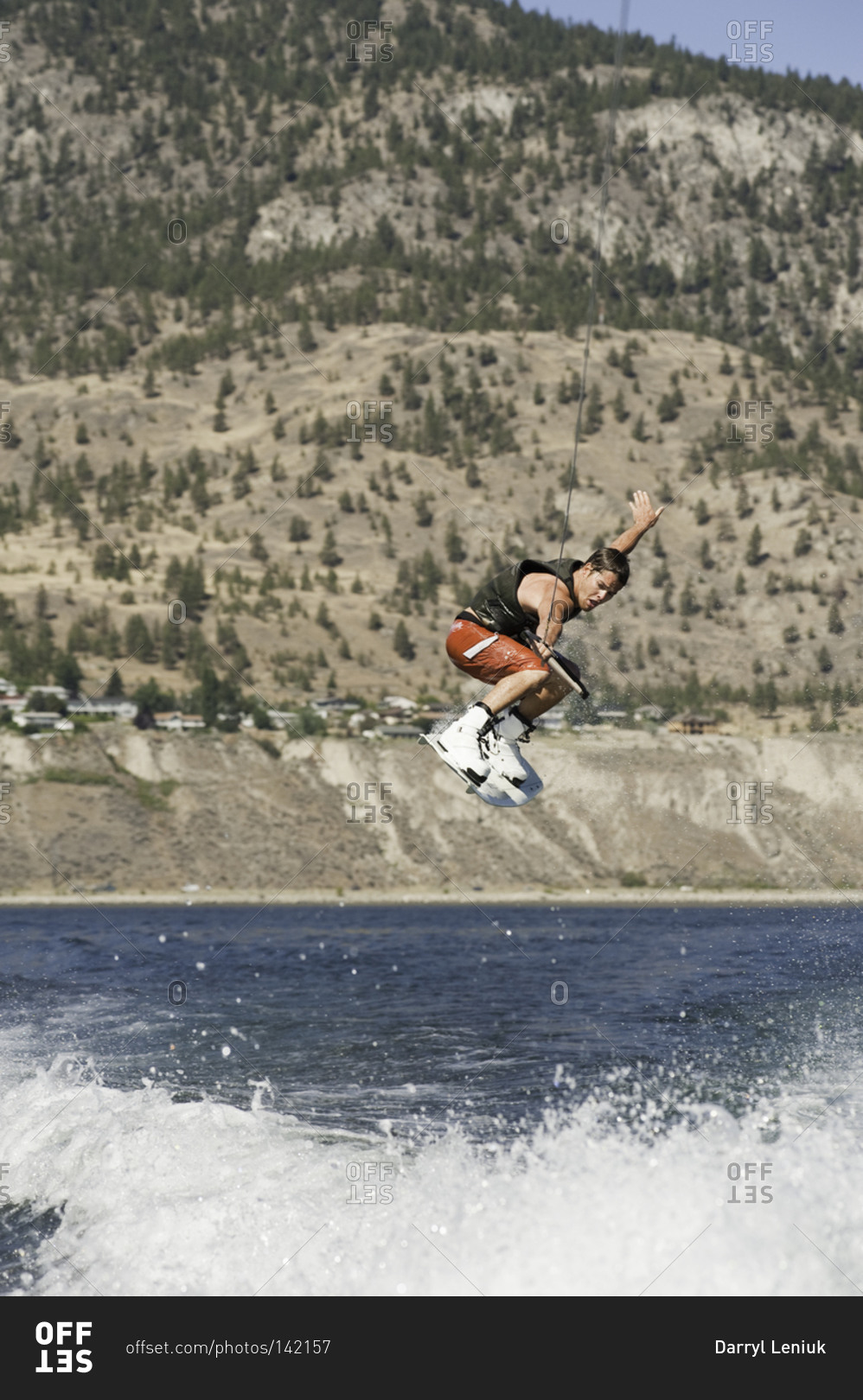 Man jumping high in the air on a wakeboard in Penticton, Canada