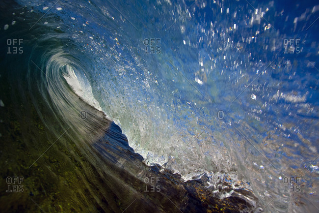 View of a turbulent ocean wave barrel