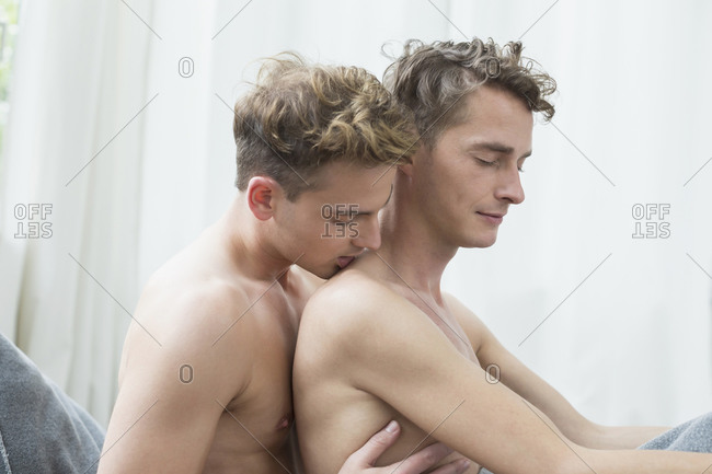Homosexual couple caress each other. close up