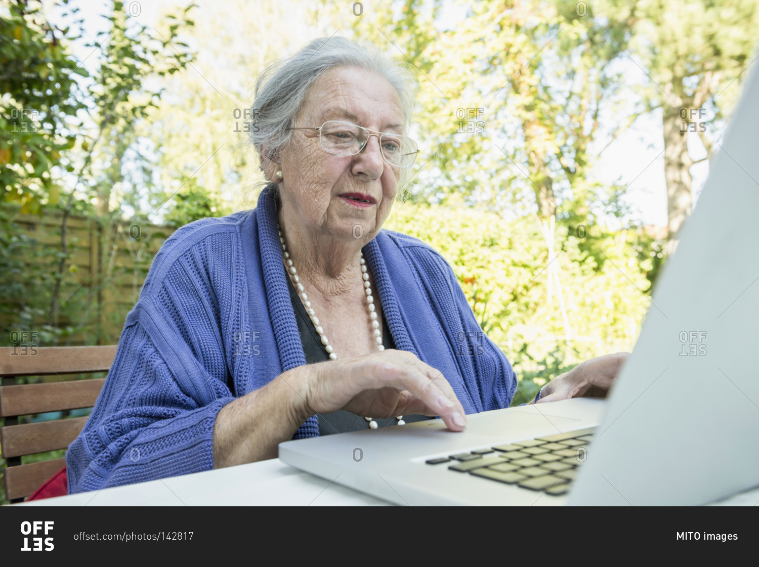 Female senior using laptop