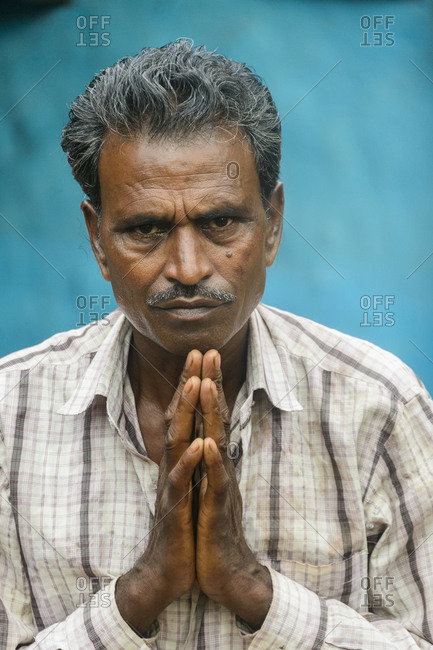 India - July 31, 2014: Man greeting with a namaste