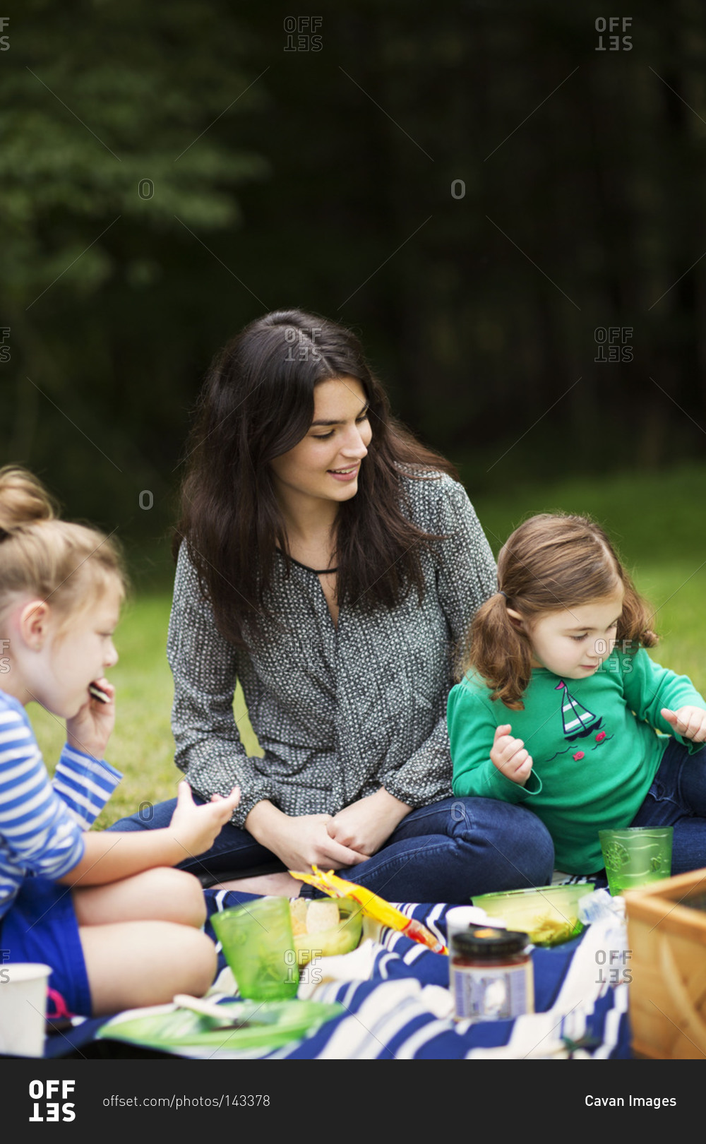 Mother with her daughters on a picnic