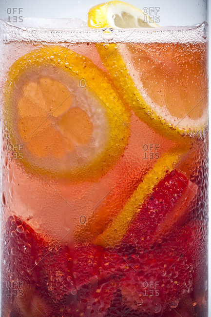 Lemon slices float in a cold drink