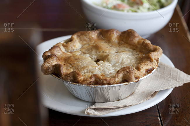 A chicken pot pie cools in a pan