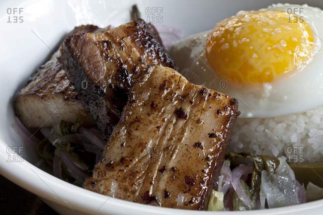 Pork belly and other Asian ingredients sit in a bowl