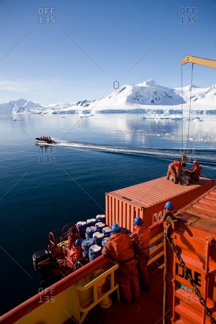 Antarctica, Paradise Bay, Chile - March 21, 2011: Men on a zodiac on Paradise Bay, Antarctica