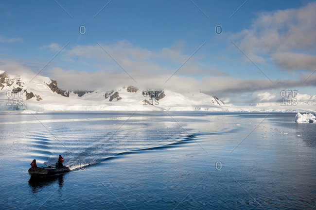 Antarctica, Paradise Bay, Chile - March 21, 2011: Men on a zodiac on Paradise Bay, Antarctica