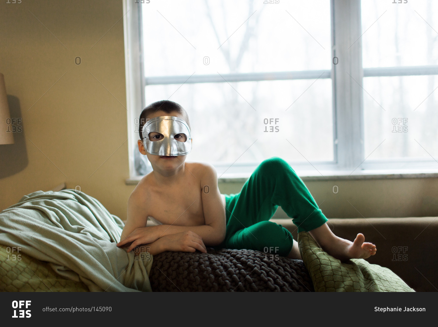 Portrait of a young boy in a mask stock photo OFFSET