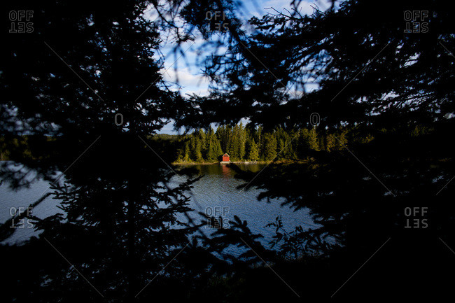 Cabin Seen Across Lake In Isle Royale National Park Stock Photo