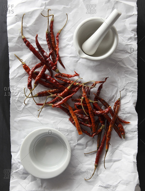 Dried chili peppers on a piece of paper