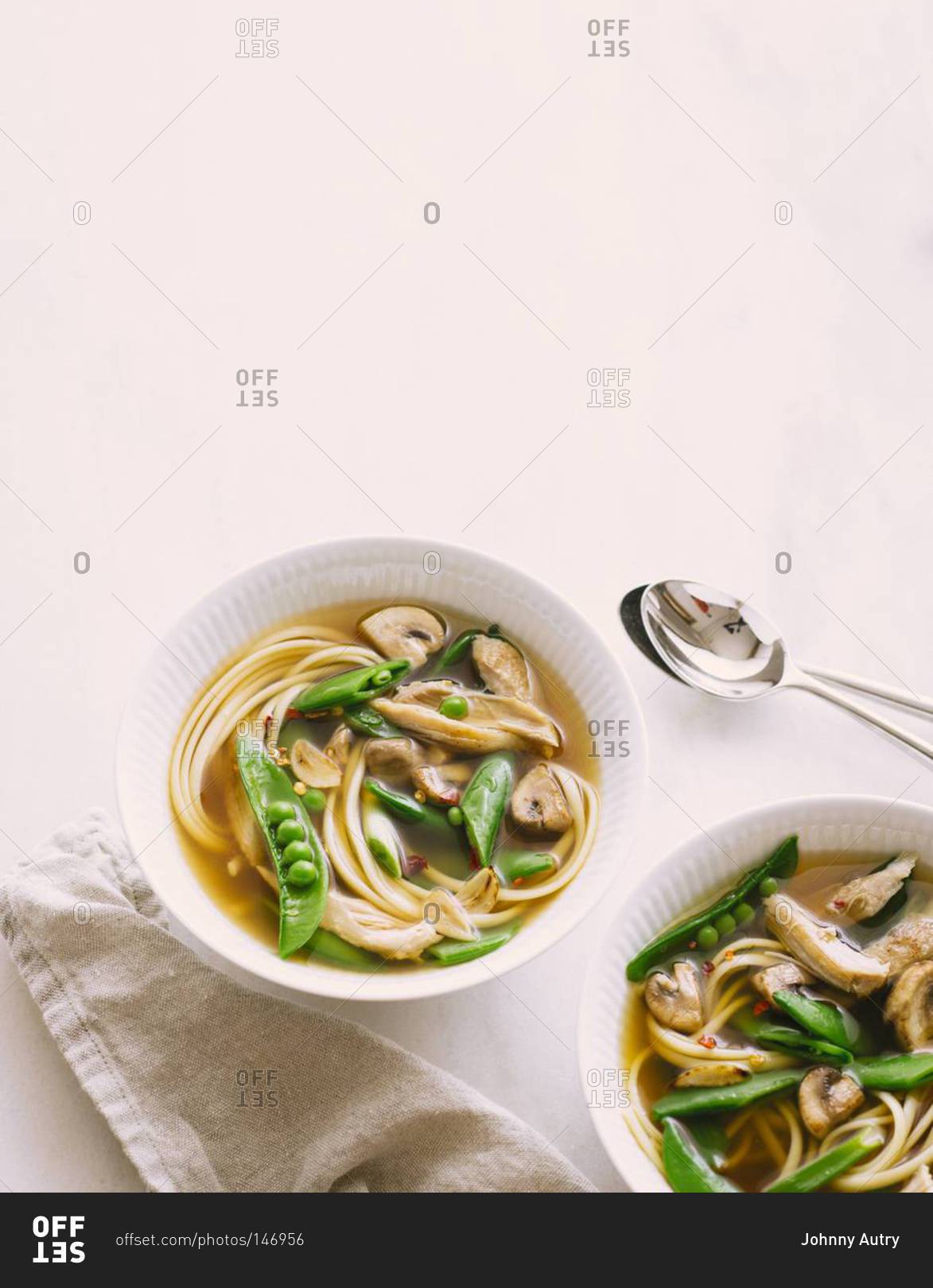 Asian chicken noodle soup with mushrooms and sugar snap peas