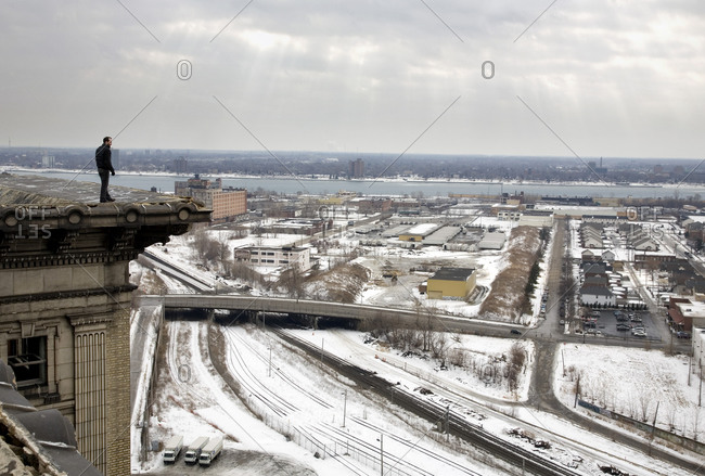 Detroit, Michigan - February 8, 2009: An artist stands on a roof