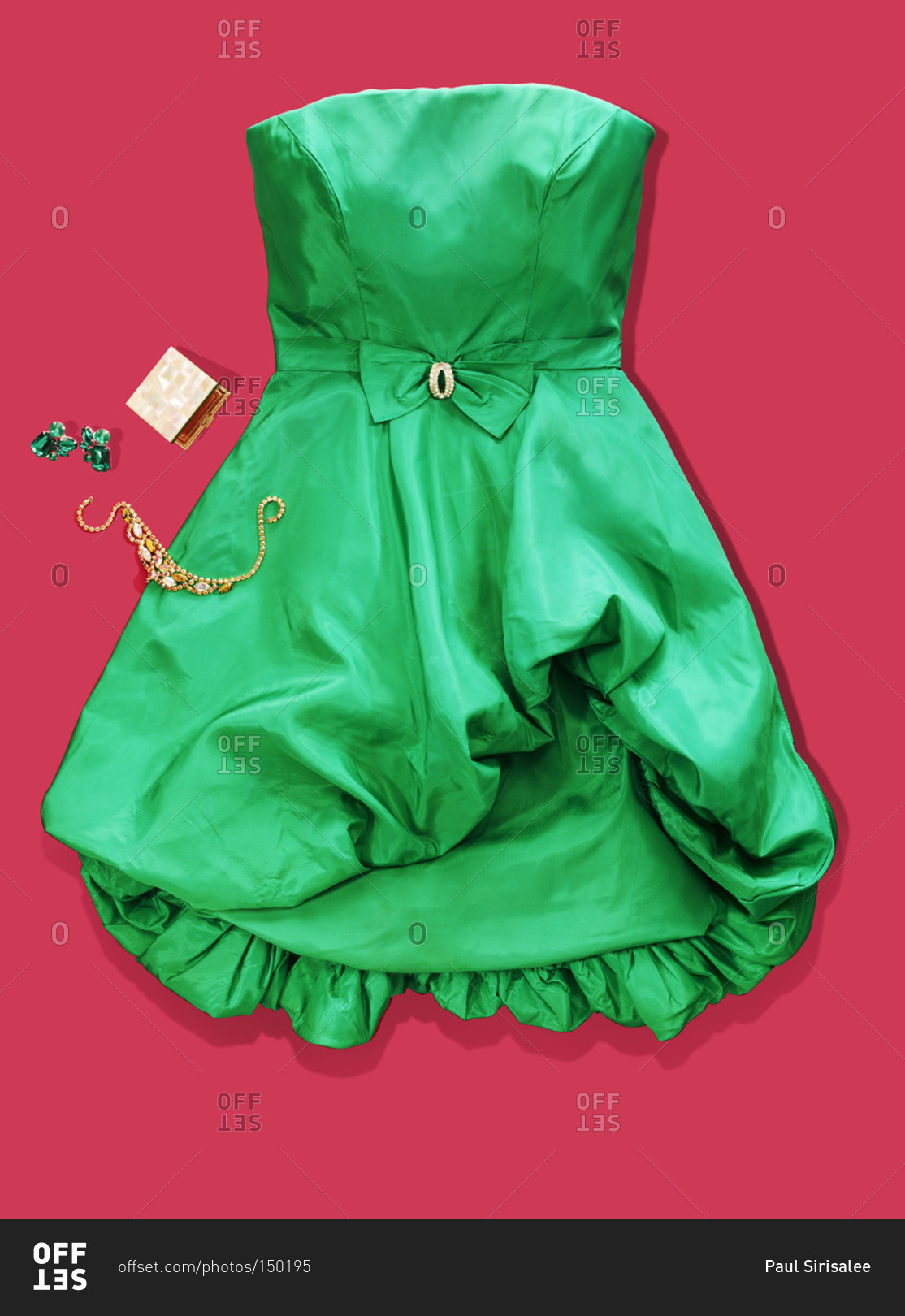 Green cocktail dress on red background