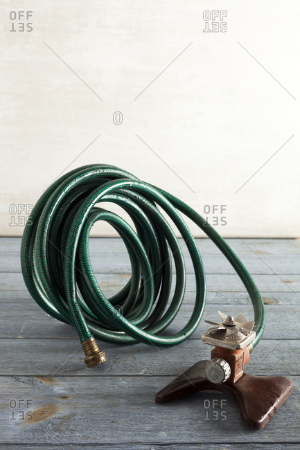 Still life of a coiled up sprinkler