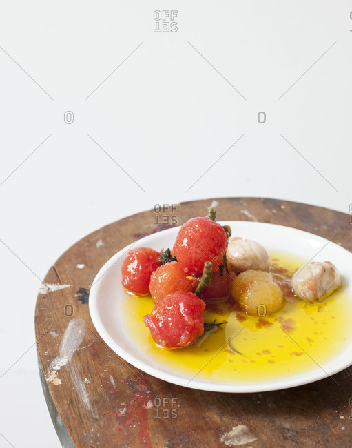 Tomato pickles with garlic served on a table