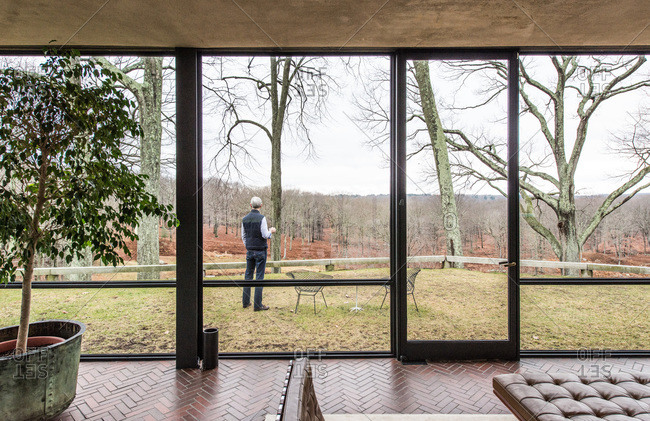 New Canaan, Connecticut - May 10, 2000: Man standing outside the Glass House in New Canaan, Connecticut
