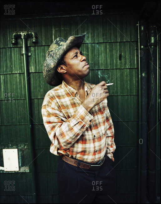 Memphis, Tennessee - February 1, 2012: Head Pit master, Henry, taking a smoke break outside of Rendezvous