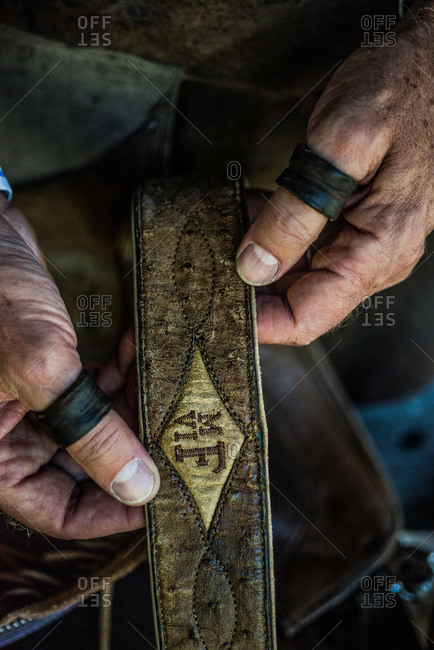 Artisan showing a handmade leather belt
