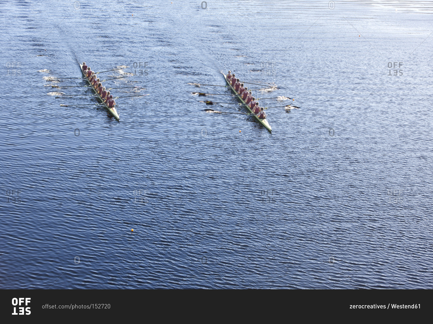 Elevated view of two rowing eights in water