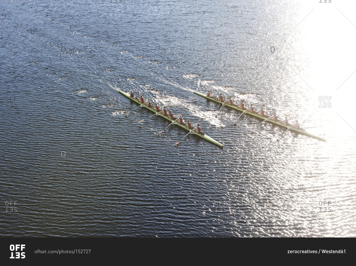 Above view of two rowing eights in water