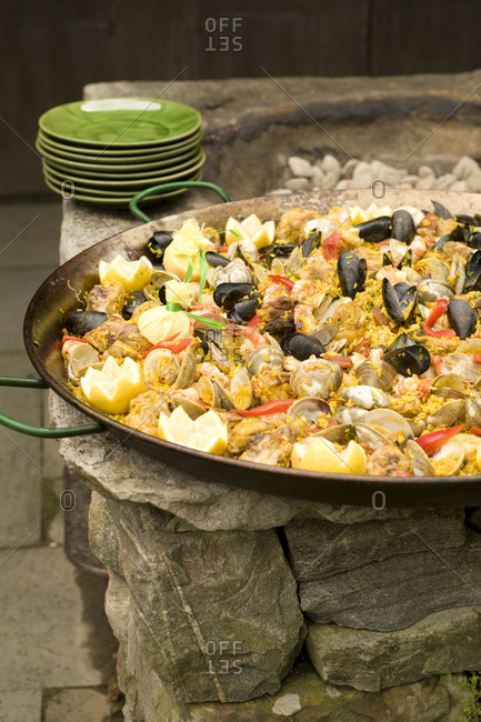 Paella In Pan On Outdoor Fire Pit Stock Photo Offset