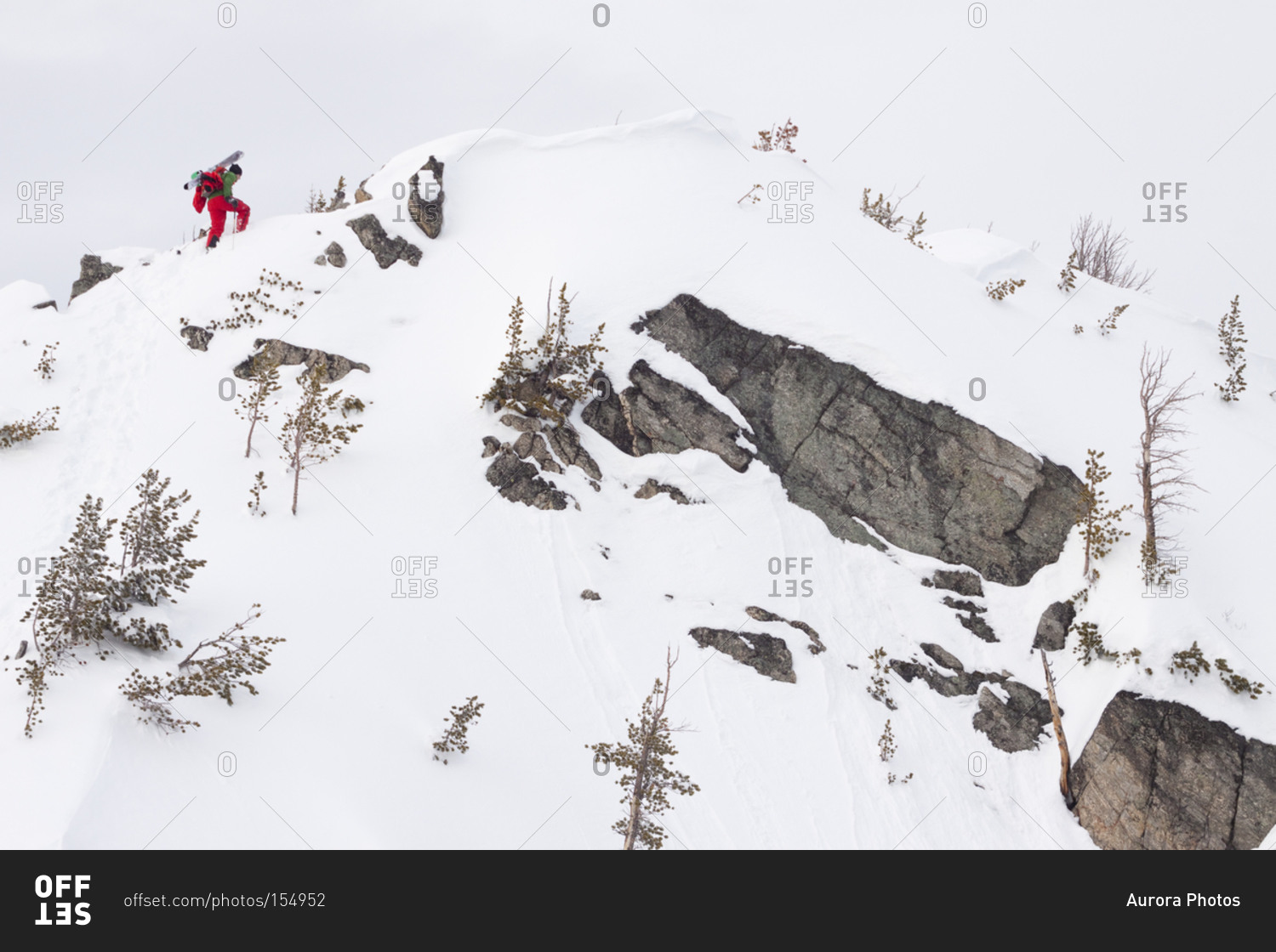 A male backcountry skier boot packs up a ridge to ski in the Beehive Basin near Big Sky, Montana