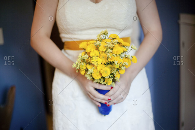 A bride holds her bouquet