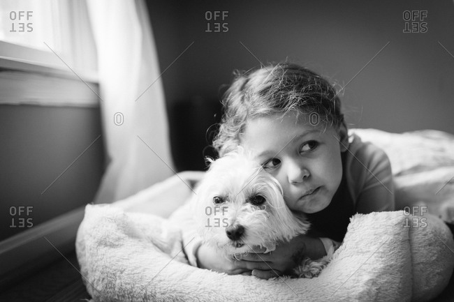 Young girl hugging a dog