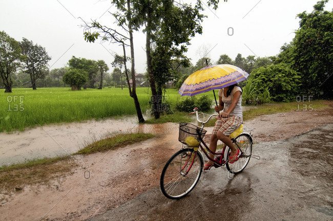 riding bike with umbrella