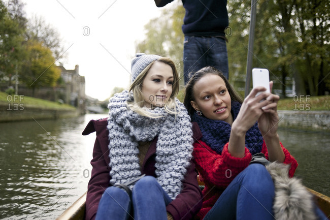 Woman and friend in punt boat