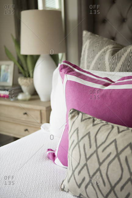 Throw pillows arranged on a bed
