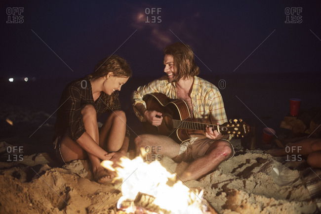 beach campfire guitar