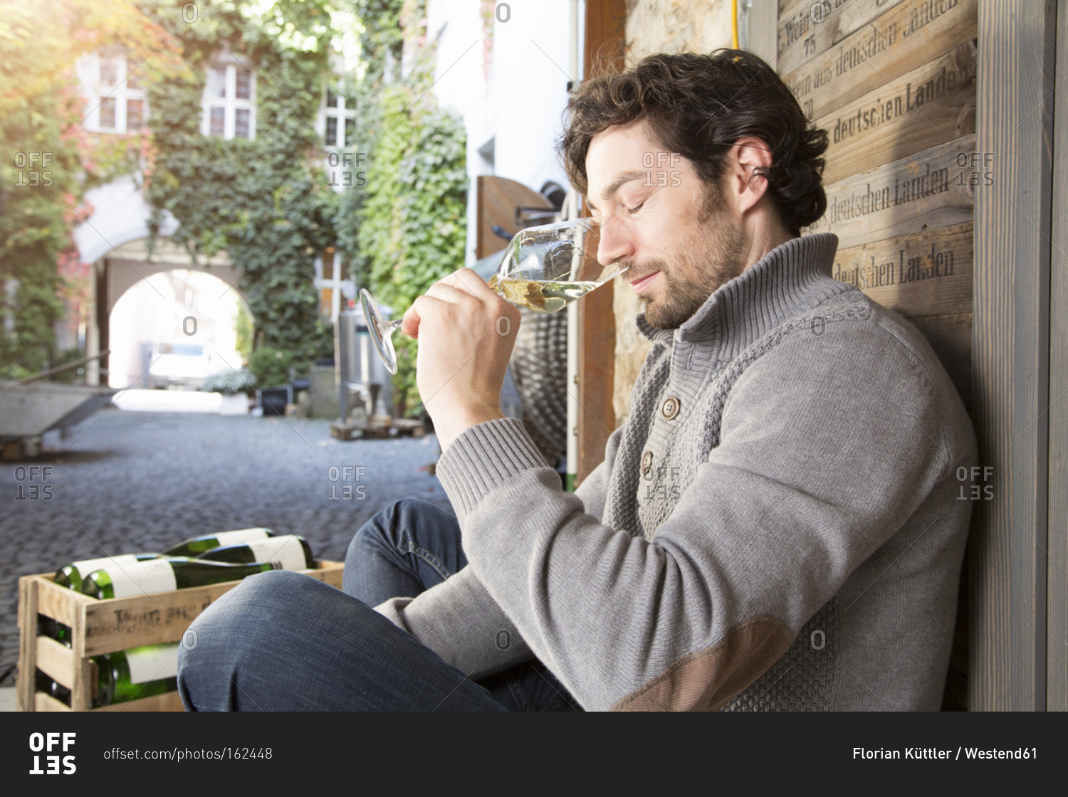 Portrait of a man tasting wine