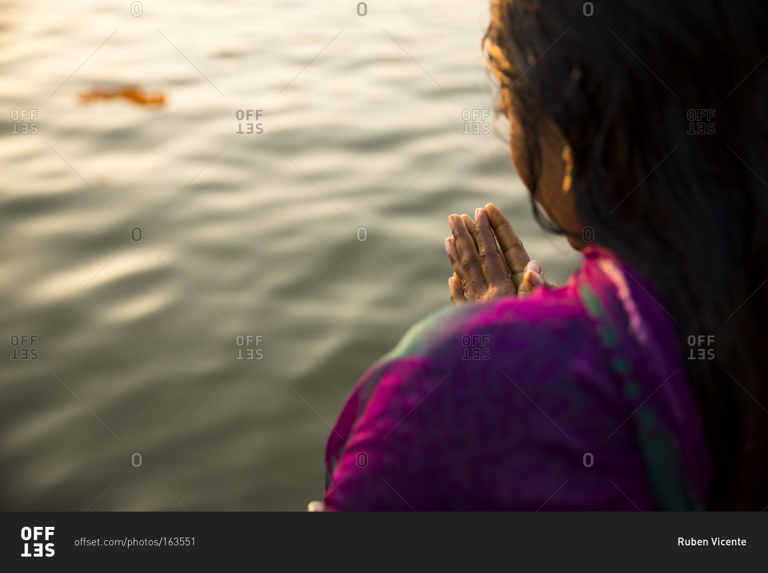 Woman praying in the Ganges, Varanasi, India