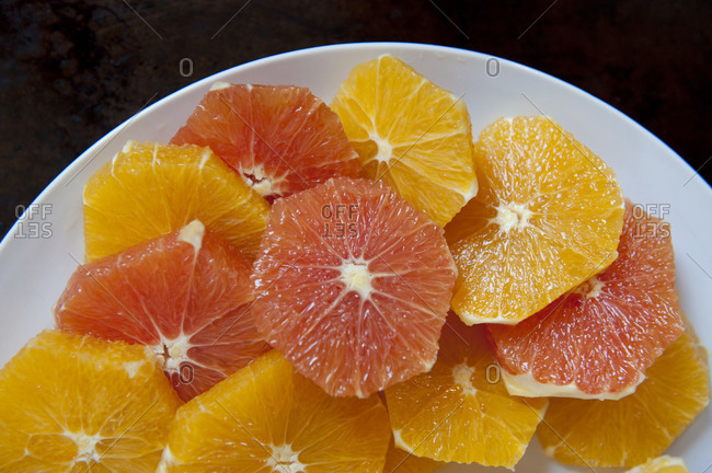 Glistening orange slices on a plate