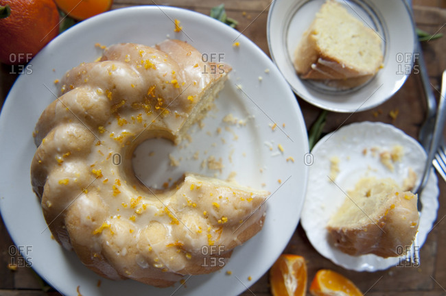 Overhead of sliced orange cake with citrus glaze